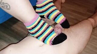 Cumming on her warm, fluffy rainbow socks - Jake & Cassandra