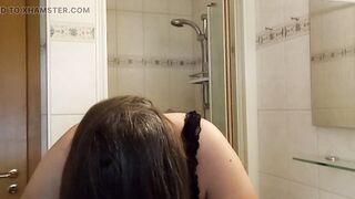Mature woman with real silver strands slowly combs her long hair